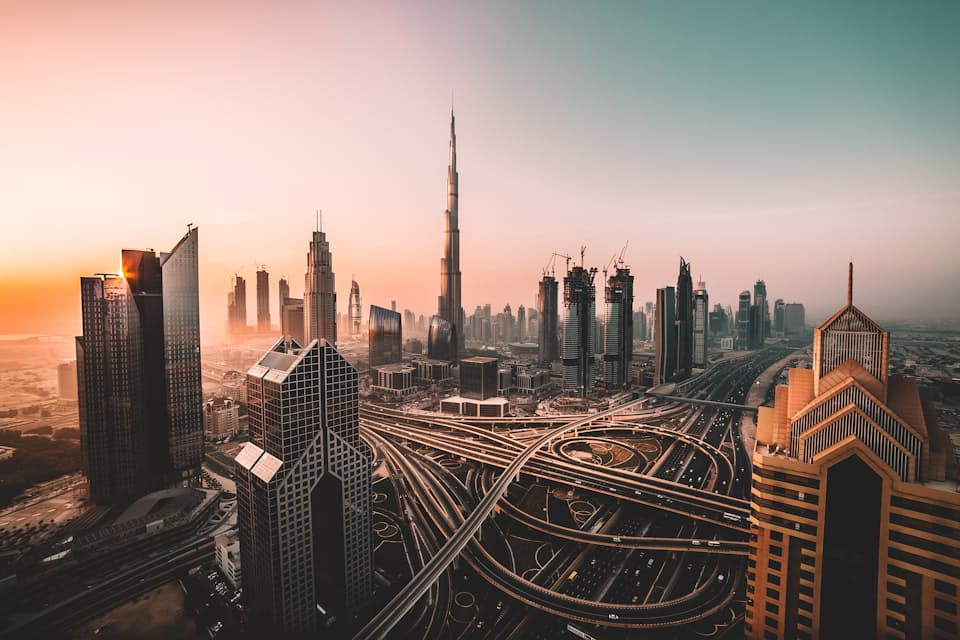 Dubai skyline at dusk with Burj Khalifa rising above the city