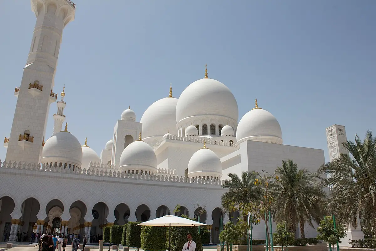 Sheikh Zayed Grand Mosque's white domes and minarets under a clear sky