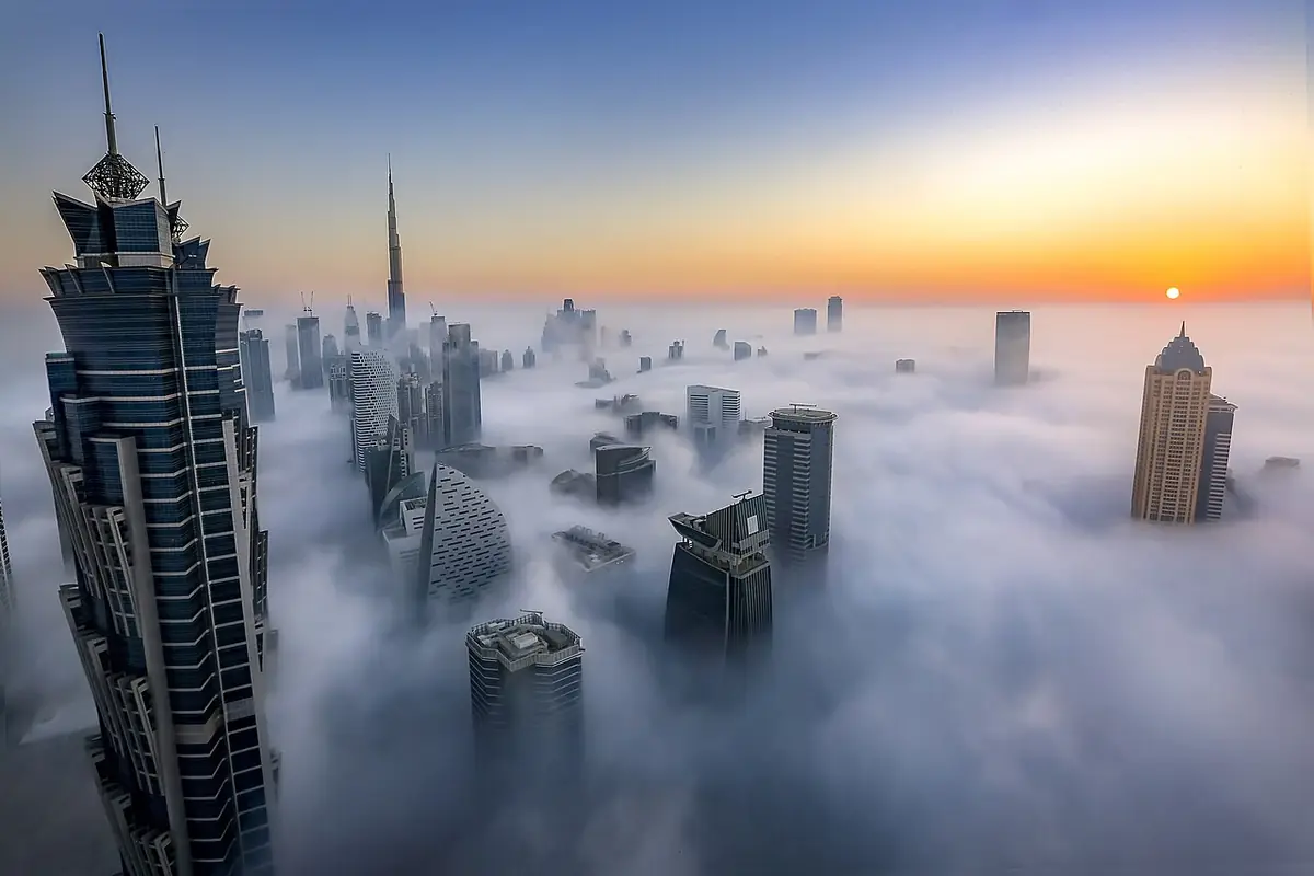 Dubai's skyscrapers rising above a sea of morning fog