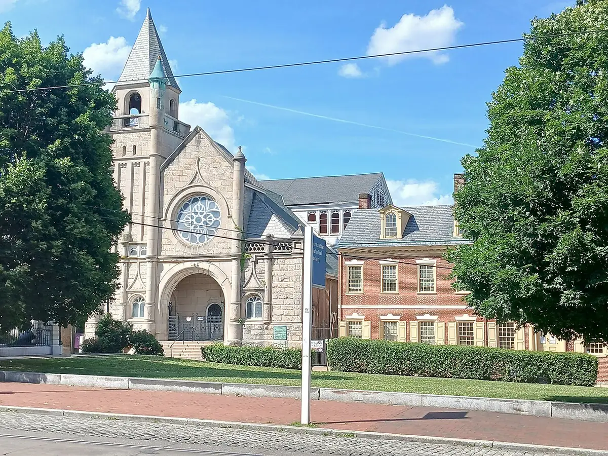 A stone church beside a red-brick building at Market Square in Germantown, Philadelphia
